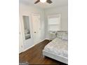 Cozy bedroom with natural light, hardwood floors and a comfortable queen-sized bed at 1081 Ashby Grv, Atlanta, GA 30314
