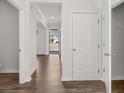 Inviting entryway with hardwood floors and white doors leading to the living spaces in the home at 3941 Fairhaven Rd, Lithia Springs, GA 30122