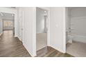 Clean hallway showcasing connections between rooms with modern design elements at 3933 Fairhaven Rd, Lithia Springs, GA 30122