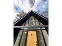 The home's A-frame design offers loads of natural light through its large windows at 4274 Smithsonia Ct, Tucker, GA 30084
