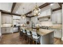 Gourmet kitchen featuring a large island, stainless steel appliances, and hardwood flooring at 4830 Westgate Dr, Cumming, GA 30040
