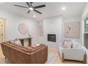 Modern living room showcases a fireplace with white marble, and updated light fixtures at 1227 Epworth Sw St, Atlanta, GA 30310