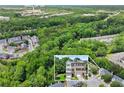 Aerial view of townhome community with lush green surroundings and close proximity to the Mall of Georgia at 2138 Mill Garden Run, Buford, GA 30519