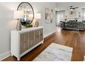 Bright foyer with hardwood floors, modern console table, and stylish decor accents at 2428 Mills Bnd, Decatur, GA 30034