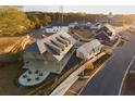 Aerial view of the community pavilion with ample seating and charming architecture at 41 Hydrangea Unit 73 Ln, Auburn, GA 30011
