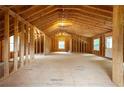 Large unfinished bonus room with natural light and wooden frame perfect for customization at 5322 Seaton Dr, Atlanta, GA 30338