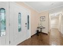 Spacious foyer with hardwood floors, decorative doors, and closet space at 1260 Willeo Creek Dr, Roswell, GA 30075