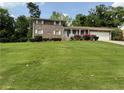 Charming brick home with a well-manicured lawn and inviting curb appeal at 3662 Greentree Farms Dr, Decatur, GA 30034
