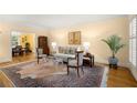 Cozy living room with hardwood floors, neutral walls, fireplace, and adjacent dining area at 40 Ivy Chase Ne, Atlanta, GA 30342