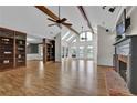 Sun-filled living area featuring a brick fireplace, built-in shelves and large windows at 5950 Meadow Brook Ln, Cumming, GA 30040