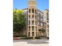 Attractive multi-story condo building with a brick and tan facade and several balconies at 390 17Th Nw St # 4055, Atlanta, GA 30363