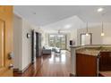 Bright and airy living room with hardwood floors, open floor plan, and access to a balcony at 390 17Th Nw St # 4055, Atlanta, GA 30363