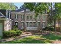 Spacious backyard featuring a well-maintained lawn and lush landscaping at 181 Sentinel Pl, Marietta, GA 30067