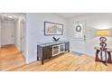Entryway featuring hardwood floors, stylish console table, and decorative accents at 1646 Highway 92 N, Fayetteville, GA 30214