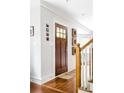 Inviting foyer with hardwood floors, white trim, and a staircase with wooden banisters at 138 Garland Ave, Decatur, GA 30030