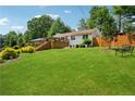 Expansive backyard with lush green grass and a welcoming deck, perfect for outdoor entertaining and relaxation at 1932 Brenda Dr, Austell, GA 30168