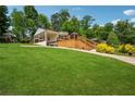 Wide open backyard showing a spacious yard and a deck, great for enjoying the outdoors at 1932 Brenda Dr, Austell, GA 30168
