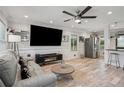 Inviting living room featuring recessed lighting, stainless steel appliances, and an open layout perfect for entertaining at 1932 Brenda Dr, Austell, GA 30168