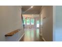Bright entryway featuring hardwood floors and an open floor plan with views into the living room at 1835 Wellston Dr, Lawrenceville, GA 30043