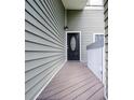 Welcoming front entryway featuring gray wood decking and an elegant front door at 325 Berry Ct, Villa Rica, GA 30180