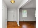 Inviting entryway showcasing a front door, neutral walls, and hardwood floors at 3900 Bressler Cir, Decatur, GA 30035