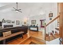 Spacious living room features hardwood floors, fireplace, and vaulted ceilings at 4915 Bayberry Dr, Cumming, GA 30040