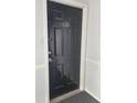 A solid black front door with unit number J-1 at 3301 Henderson Mill Rd # J1, Atlanta, GA 30341