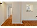 Hallway with hardwood floors leading to an open kitchen and other rooms at 3301 Henderson Mill Rd # J1, Atlanta, GA 30341