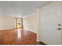 Spacious living room with hardwood floors and natural light from the large window at 3301 Henderson Mill Rd # J1, Atlanta, GA 30341