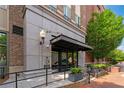 Street view of a building with a modern entrance and awning. The building has brick and concrete siding at 58 Canton St # 404, Alpharetta, GA 30009