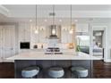 Stunning kitchen with marble countertops, stainless appliances, island seating and ample cabinetry at 58 Canton St # 404, Alpharetta, GA 30009
