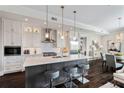 Gorgeous kitchen featuring a center island, stylish pendant lighting, and stainless steel appliances at 58 Canton St # 404, Alpharetta, GA 30009