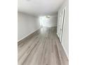 Bright, open living area with modern gray vinyl plank flooring and a ceiling fan at 127 Deer Xing, Temple, GA 30179