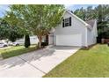 Charming home featuring a two-car garage and well-maintained landscaping at 285 Kentshire Pl, Lawrenceville, GA 30044