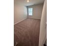Cozy bedroom with neutral carpet, natural light from the window and fresh paint at 451 Courthouse Park Dr, Temple, GA 30179