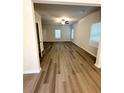 Bright living room featuring modern flooring and an open concept design at 836 Courthouse Park Dr, Temple, GA 30179