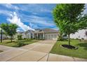 Beautifully landscaped front yard leads to this charming home with a two car garage and inviting curb appeal at 250 Cordova St, Woodstock, GA 30189