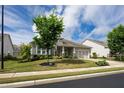 Lovely home with manicured lawn, landscaping, and a convenient two-car garage at 250 Cordova St, Woodstock, GA 30189