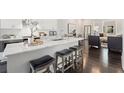 Modern kitchen with a large island, marble countertop, and stainless steel appliances at 456 Parkway Ne Dr # 10, Atlanta, GA 30308