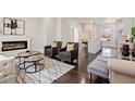 Bright living room featuring a fireplace, stylish furniture, and hardwood floors at 456 Parkway Ne Dr # 10, Atlanta, GA 30308