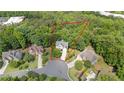 An aerial view of the home and its surrounding lush landscape at 1360 Woodvine Way, Alpharetta, GA 30005