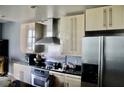 Modern kitchen with stainless steel appliances, sleek countertops, and contemporary cabinetry at 250 Park Avenue West # 802, Atlanta, GA 30313