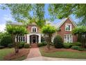 Charming two-story brick home with a welcoming entrance and well-maintained landscaping at 2743 Long Grove Dr, Marietta, GA 30062