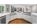Bright kitchen with a farmhouse sink, stainless steel appliances, and white cabinets at 2743 Long Grove Dr, Marietta, GA 30062