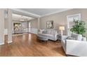 Cozy living room with hardwood floors, neutral tones, and comfortable seating at 4648 Glenshire Pl, Atlanta, GA 30338