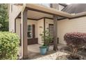 Inviting covered front porch with decorative columns and manicured landscaping, leading to a welcoming entrance at 856 Donington Cir, Lawrenceville, GA 30045