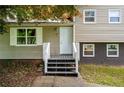 Inviting front entrance with a small porch and white railing at 115 S Meadowcliff Cir, Carrollton, GA 30116