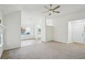 Inviting living space with neutral tones, vaulted ceiling, lots of light, and a view to the kitchen at 4787 Burford Nw Ct, Acworth, GA 30102