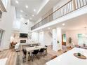Open-concept living area with high ceilings and ample natural light throughout at 3180 Lee Dr, Buford, GA 30518