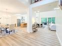 Bright open-concept living spaces with elegant dining area, kitchen, and living room views at 3180 Lee Dr, Buford, GA 30518